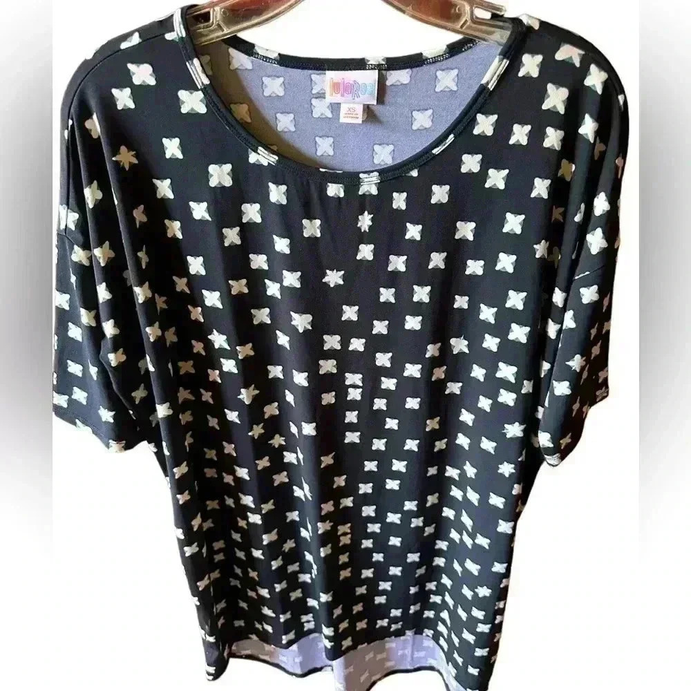 Lularoe XS black Irma tunic length top with cream and teal cross pattern. NWT